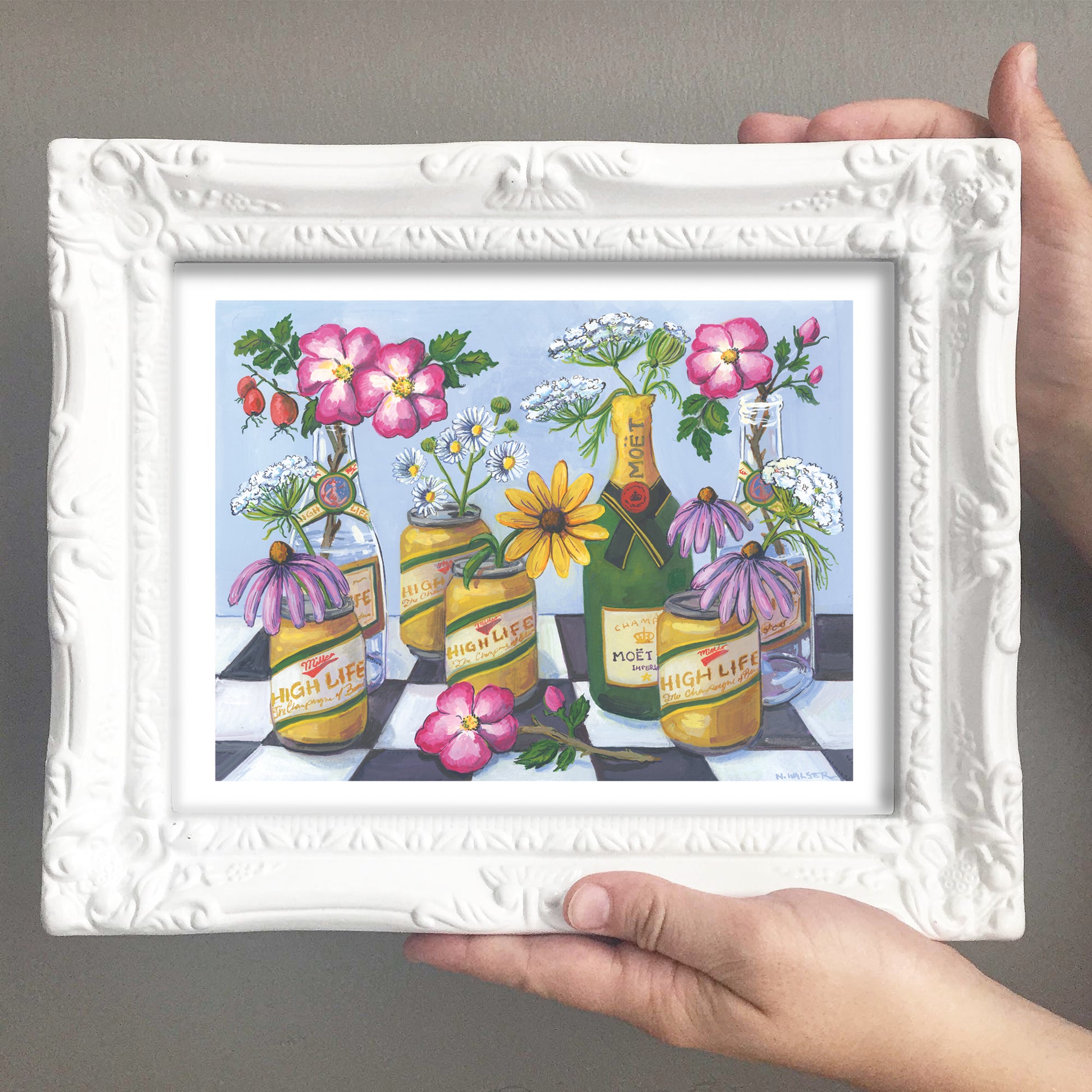 Framed artwork of flowers in beer cans