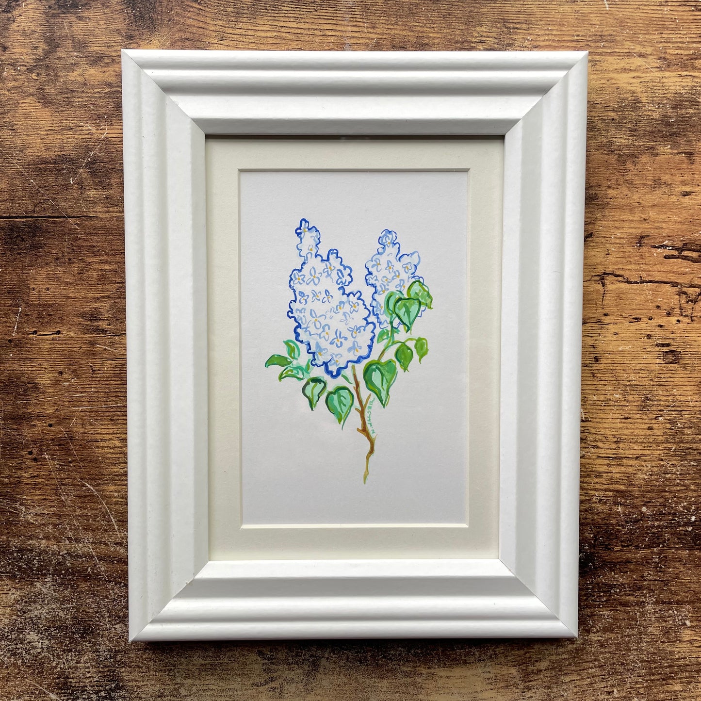 Framed artwork of lilac flowers