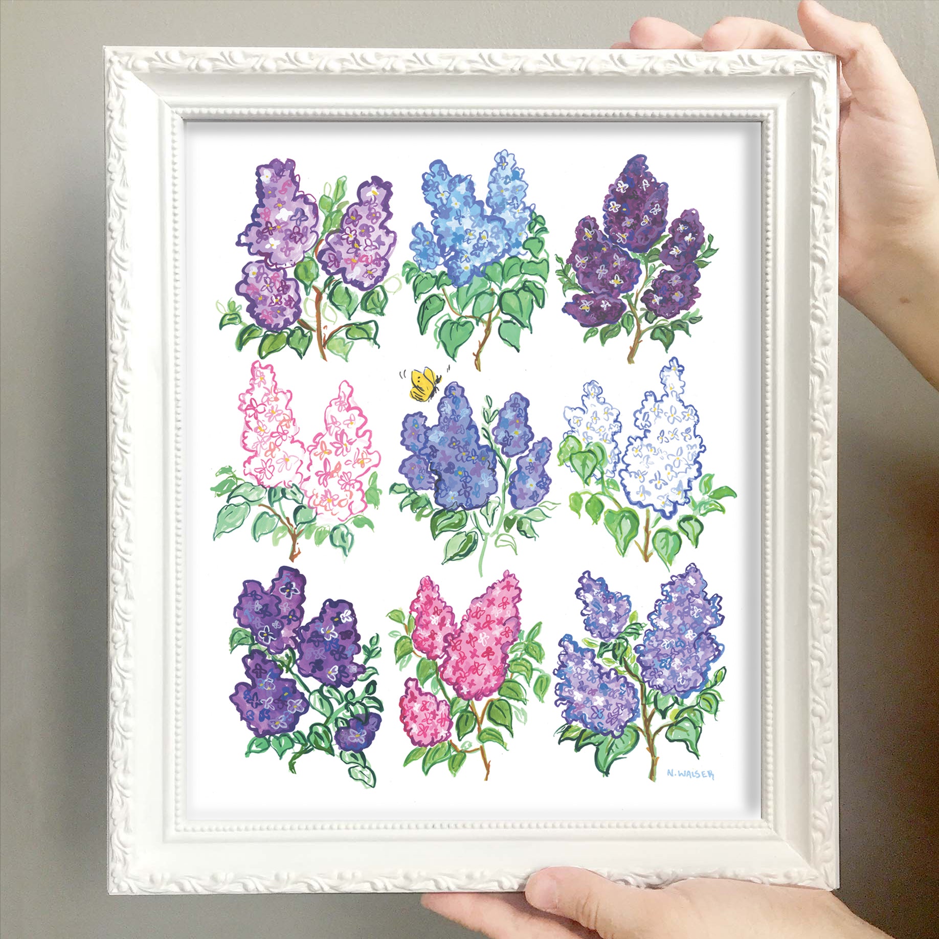 Framed artwork of colorful floral lilac designs