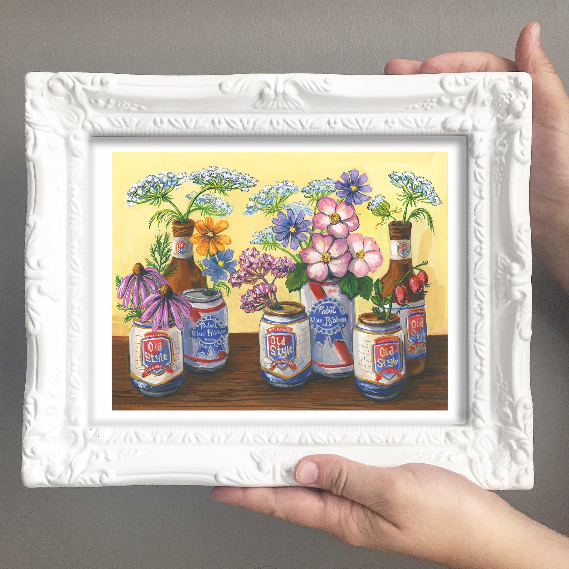 Framed artwork of flowers and Old Style bottles and flowers