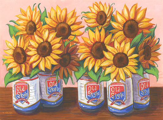 Sunflowers in Old Style beer cans on a wooden surface with a pink background