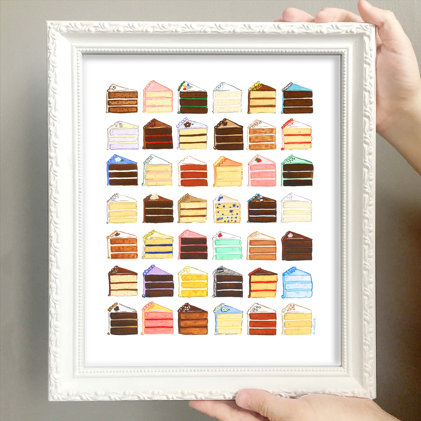 Framed artwork of colorful cake slices 