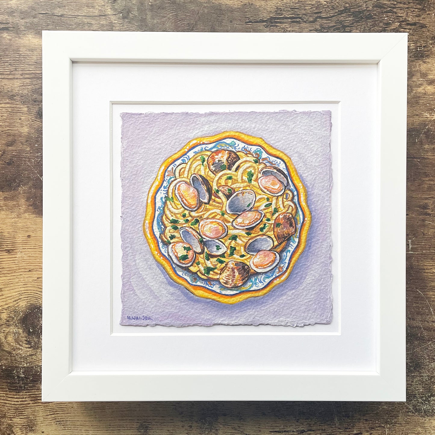 Framed artwork of a plate with shellfish on a textured background