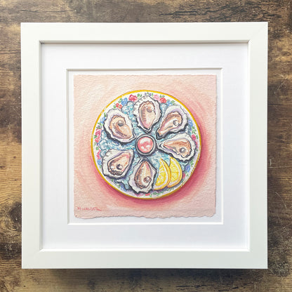 Framed artwork of a plate with oysters and flowers on a wooden surface