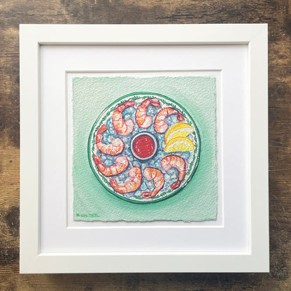Framed artwork of a shrimp cocktail design on a green background