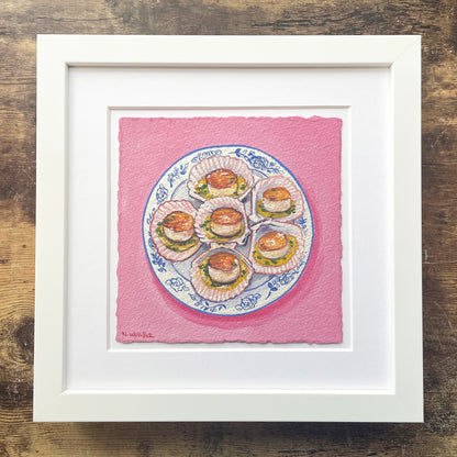 Framed artwork of a plate with scallops on a pink background